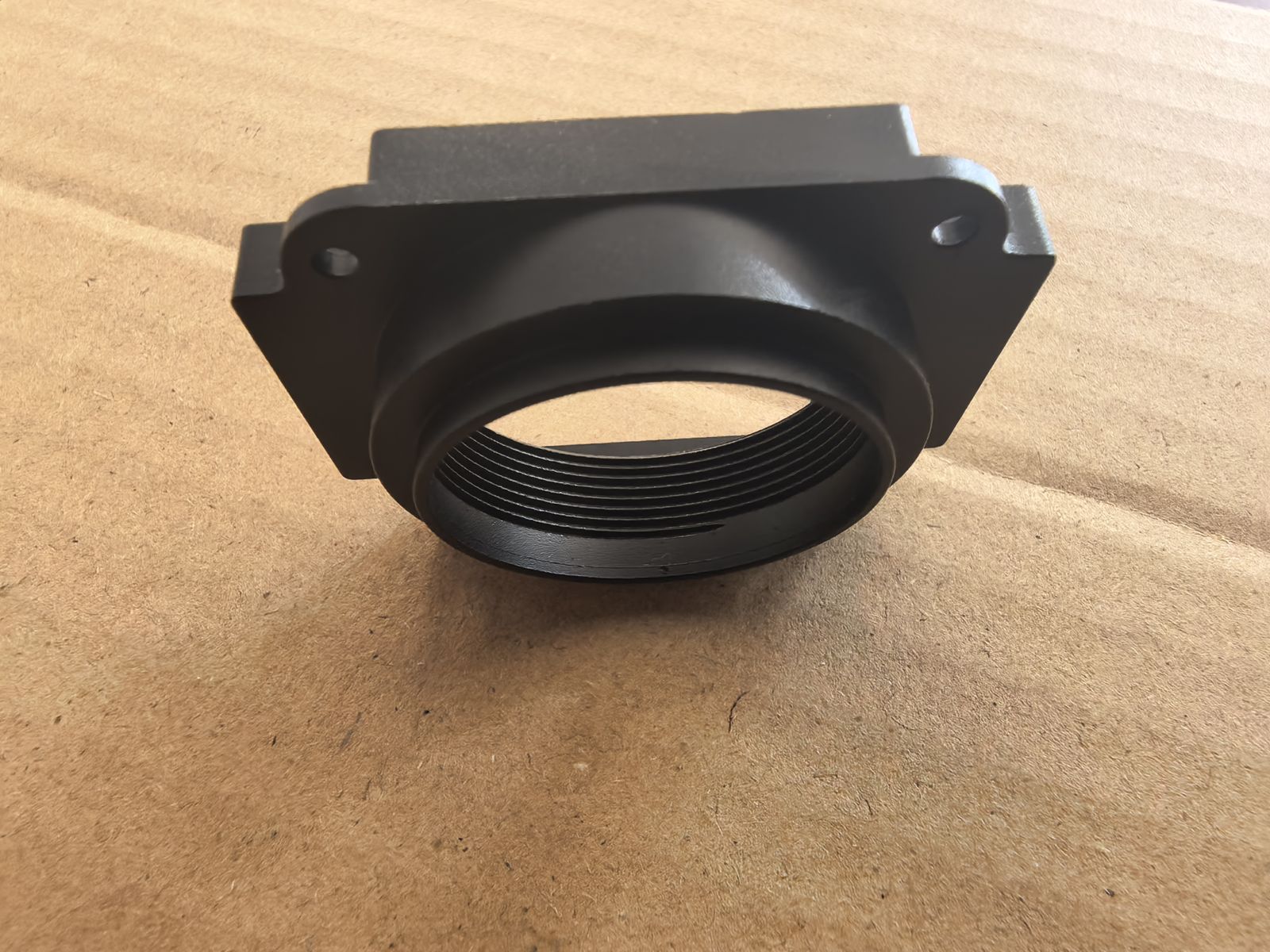 Close-up of a black anodized aluminum housing