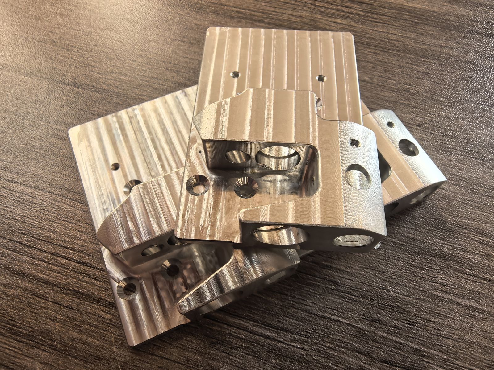 Curved aluminum parts with multiple machined features
