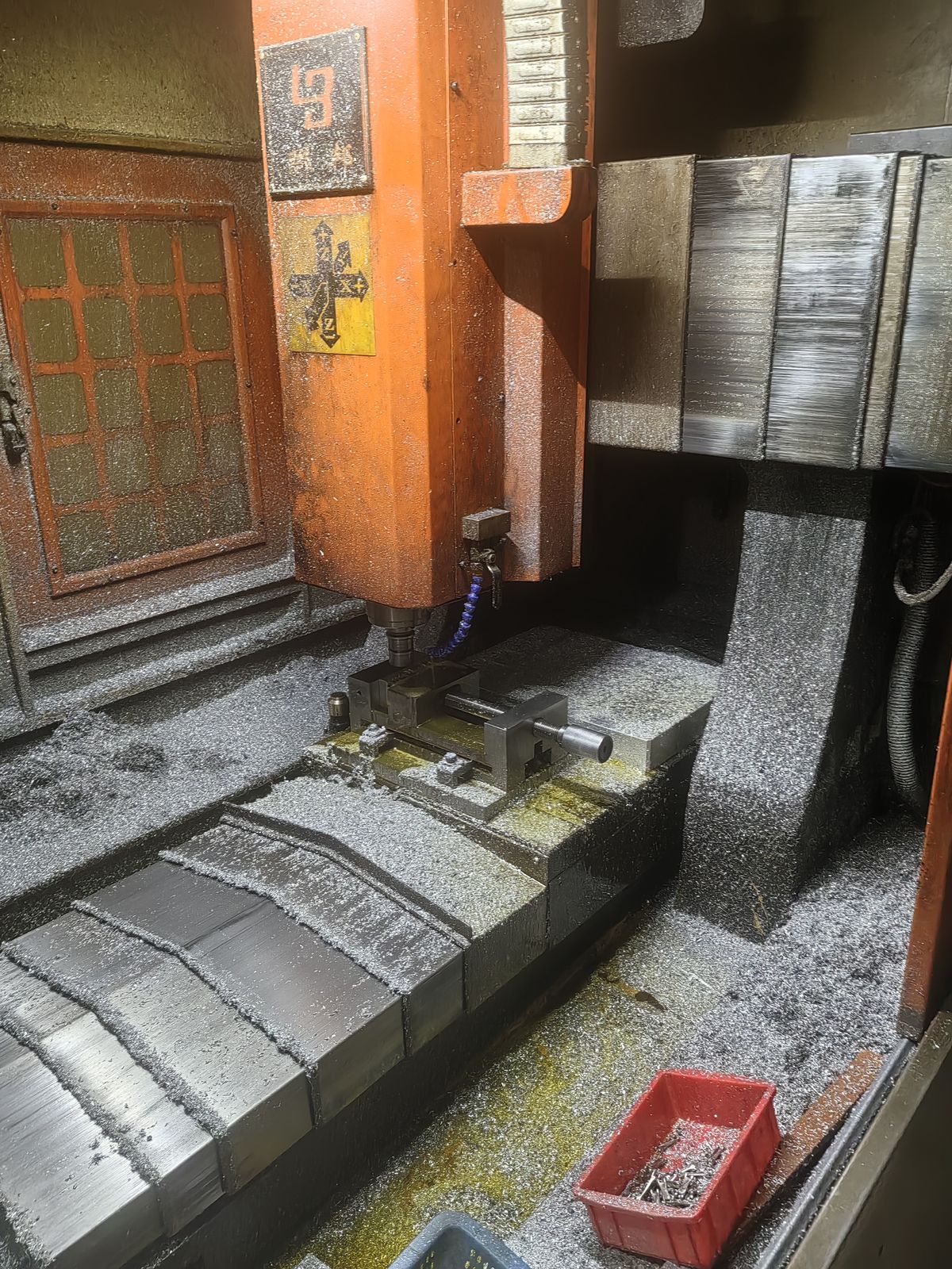Vertical machining center spindle cutting in a vise